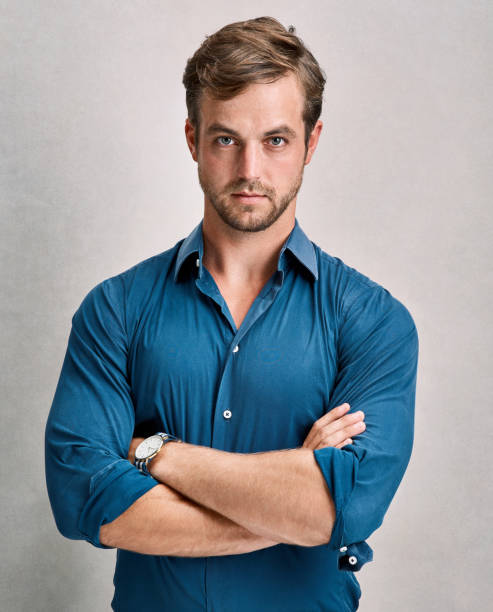 He's got a serious side Cropped portrait of a handsome young man posing in the studio men fashion model stubble serious stock pictures, royalty-free photos & images