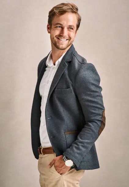 Cropped shot of a handsome young man in a suit posing in the studio