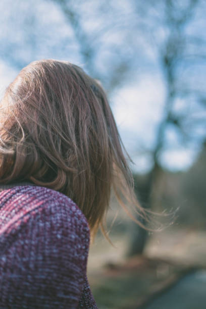 istock Young woman is walking in a forest 666968028