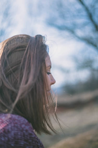 istock Young woman is walking in a forest 666968072