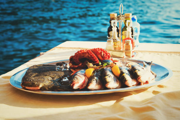 istock fresh seafood plate in restaurant at sea 666971620