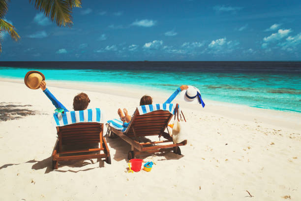 istock happy couple relax on a tropical beach 666971962