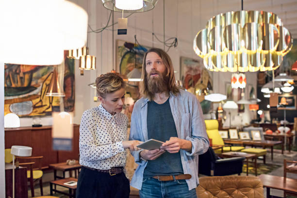 istock Owners using digital tablet in furniture store 666979484