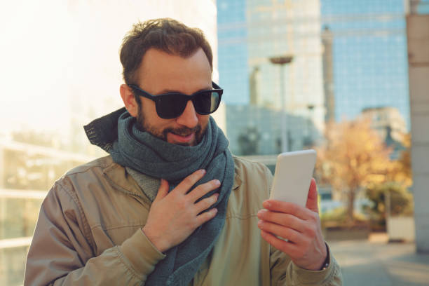 istock Modern guy using smartphone in the European city. 666980934