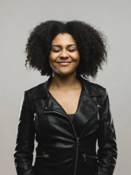 istock African woman day dreaming on gray background 666985108