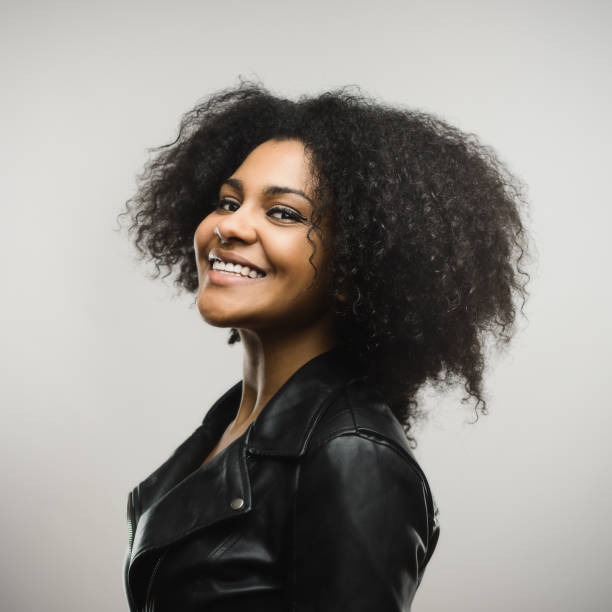 istock Cute young woman smiling at camera 666988172