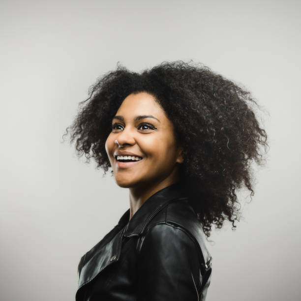 istock Cheerful young american female model looking away 666988226