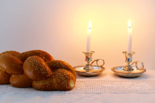 istock shabbat image. challah bread, shabbat wine and candelas 666988758