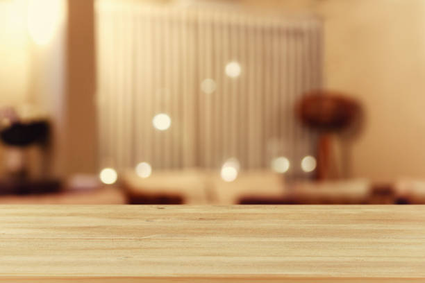 istock wooden table in front of blurred restaurant lights 666989240