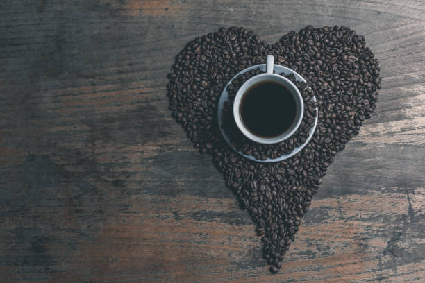 istock Freshly Roasted Coffee Beans on a Wooden Table 666991510