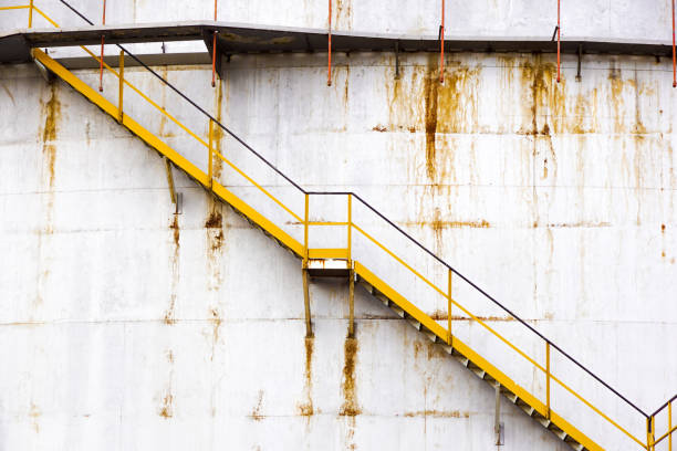 istock Staircase Going Up a Large Circular Tank silos 666995230