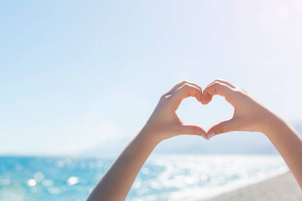 Woman making a heart shape with her hands