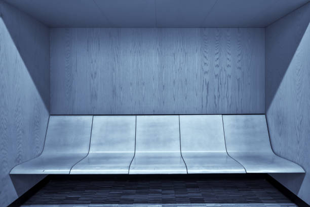istock Modern waiting room interior with empty wooden seats 667006274