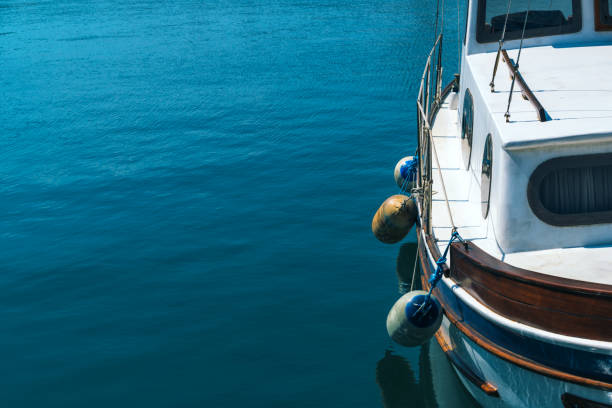 istock Small fishing boat in harbor 667006386