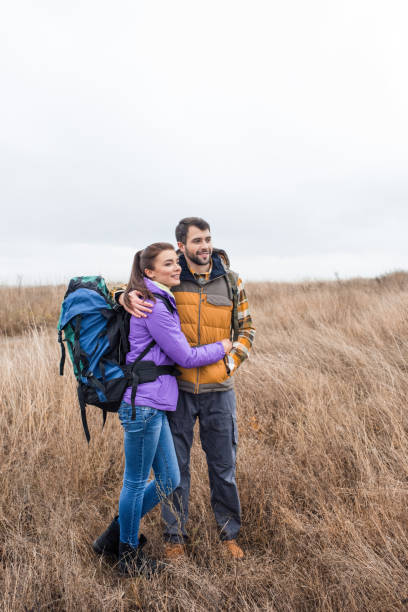 istock Happy young couple with backpacks 667006496