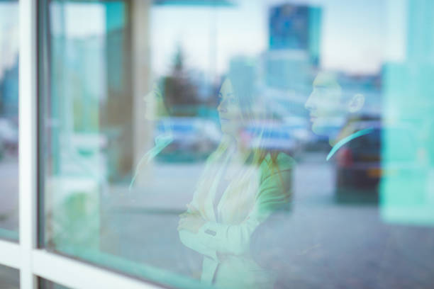 istock successful business team stands in front of a window in a modern office 667008966