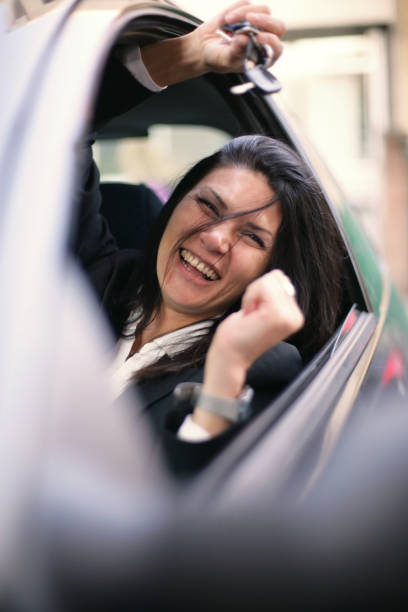 istock Happy woman in her own car 667009804