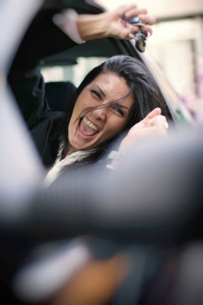 istock Happy woman in her own car 667009816