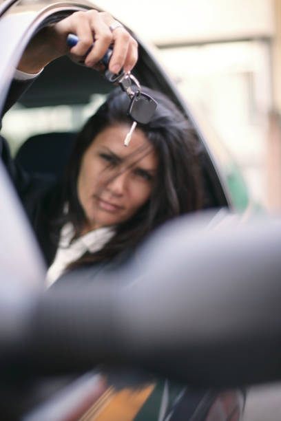 istock Happy woman in her own car 667009820