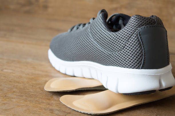istock Gray running shoes with orthopedic insoles 667015570