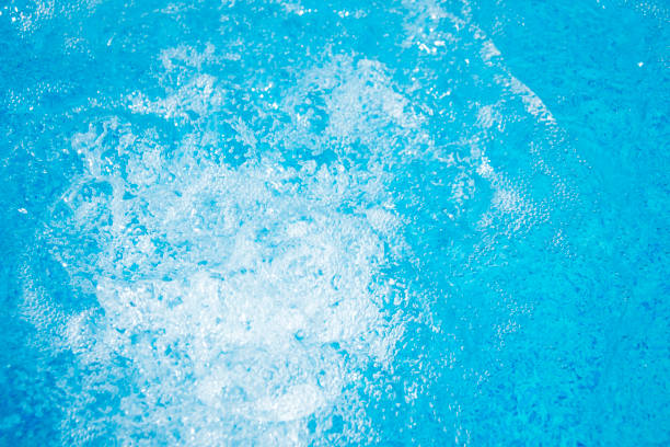 istock Blue clear fresh Water in hot tub. Spa massage background. 667015746