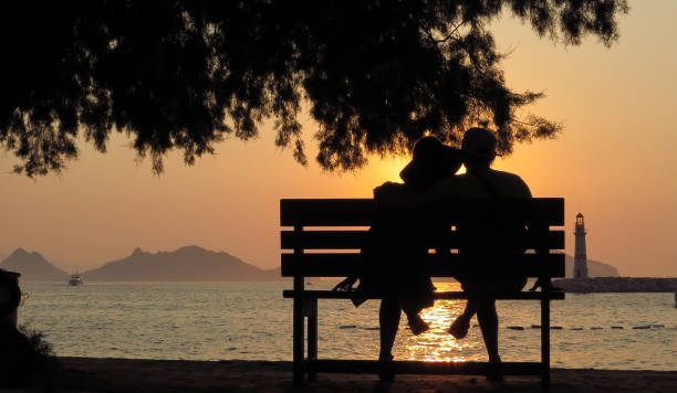 istock Loving people on the bench in silhouette 667016812