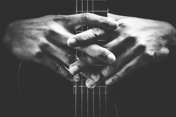 musician hands on guitar neck stock photo