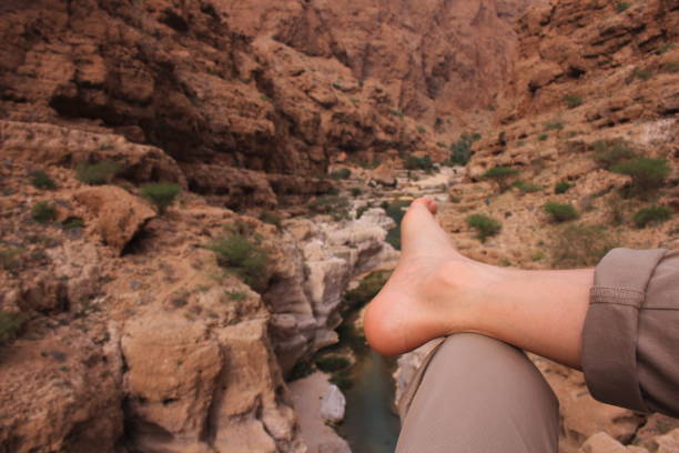 istock A man resting on the high canyon in Wadi Shab in Oman 667018262