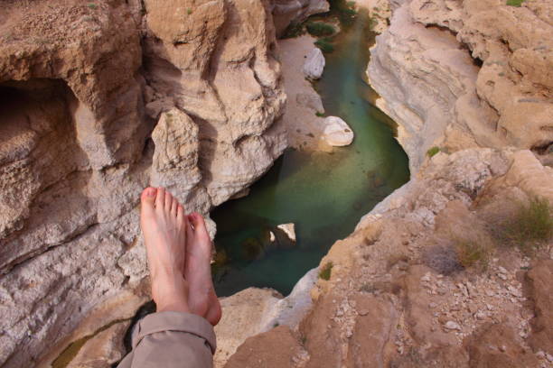 istock A man resting on the high canyon in Wadi Shab in Oman 667020488