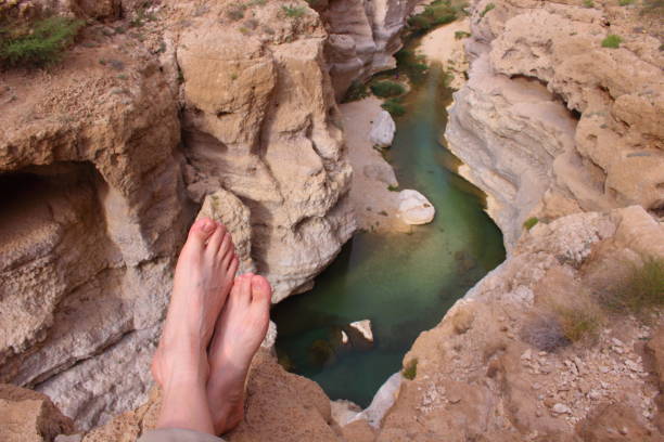 istock A man resting on the high canyon in Wadi Shab in Oman 667020724