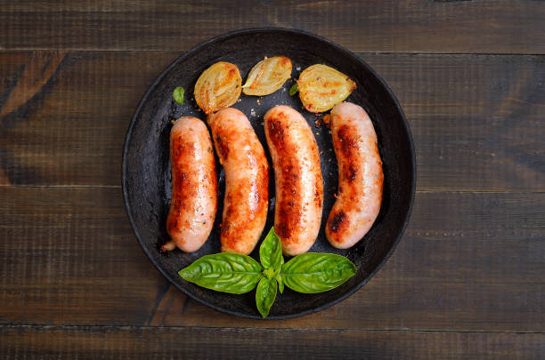 Barbecue sausages in frying pan