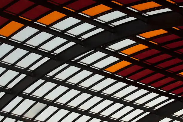 Metal roof with  colored  glass in red white and orangeMetal roof