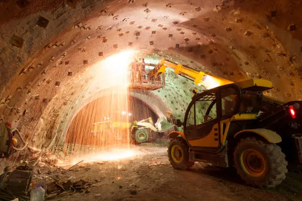 Photo of Construction Machinery Working in Tunnel Construction