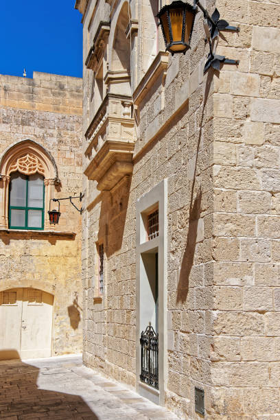 istock Narrow street with lanterns in Mdina 667026400