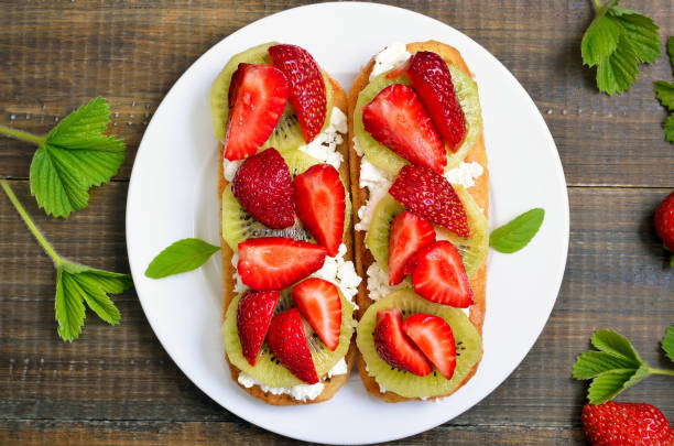 istock Sandwiches with strawberries and kiwi 667028168