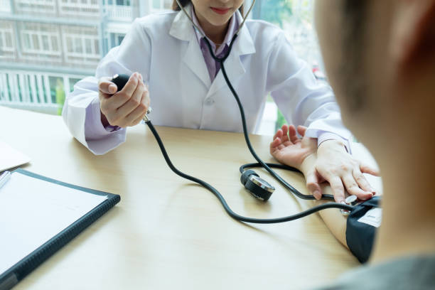 istock Doctor checking  patient arterial blood pressure. 667031360