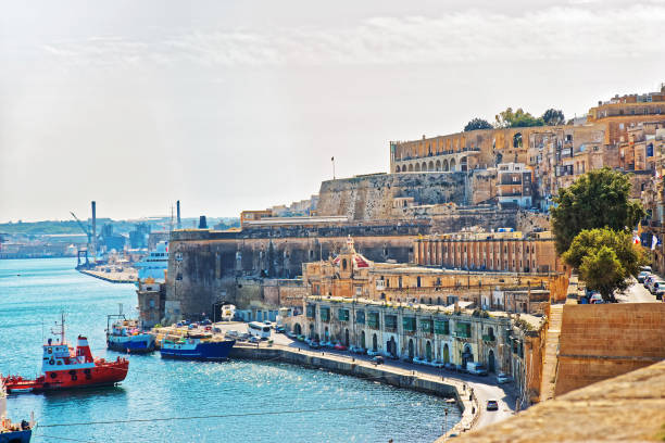 istock Dry cargo vessels at Valletta waterfront in Grand Harbor 667031596