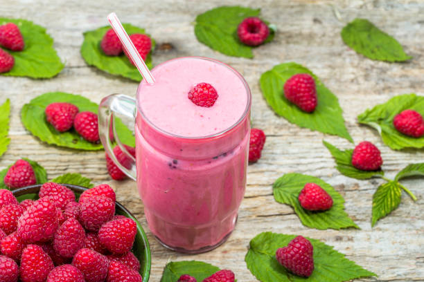 istock Blended smoothie, raspberry fresh fruits milkshake in a glass jar, overhead 667032072