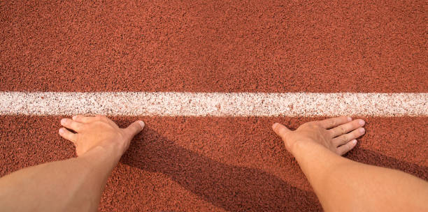 Top view Touch hands to line start for running on Athletics track stock photo