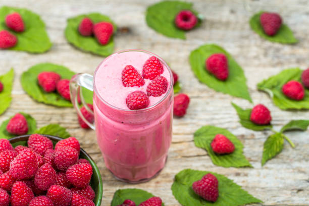 istock Smoothie yogurt with raspberries, fruit dessert, vegan diet concept 667037618