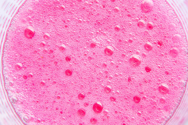 istock Red soda bubbles , texture bubbles pink In the glass background 667043832