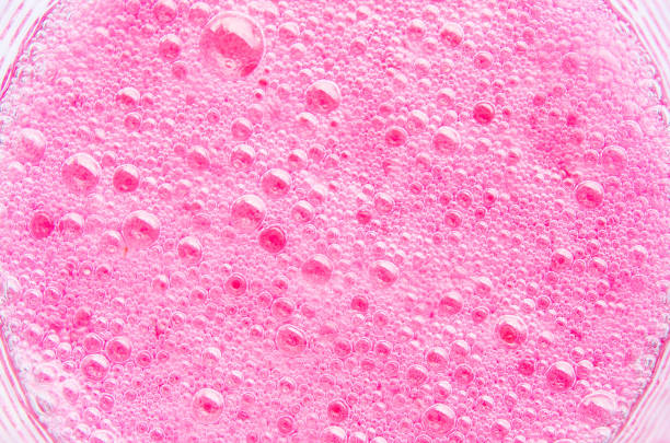 istock Red soda bubbles , texture bubbles pink In the glass background 667043838
