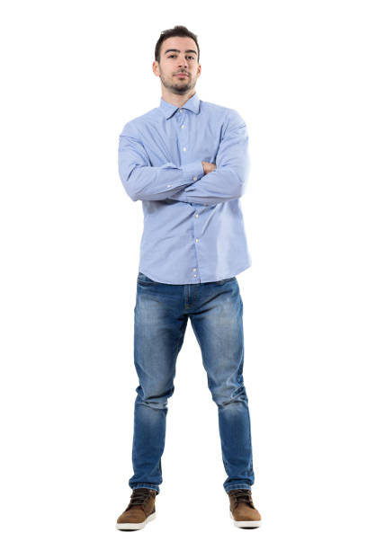 istock Front view of young confident corporate ceo with crossed arms looking at camera 667049528