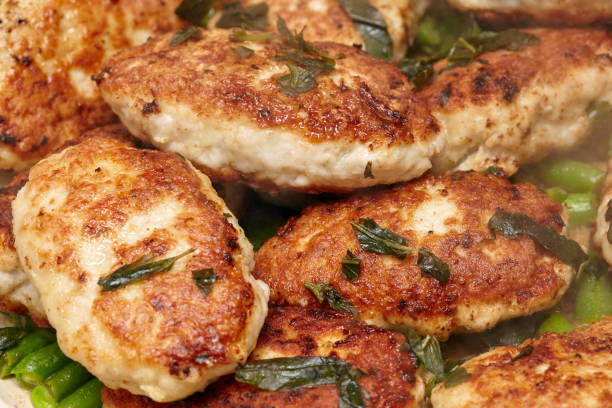 istock Meat rissoles or cutlets in frying pan, cooking process 667049684