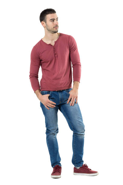 istock Relaxed cool young handsome casual man with thumbs in pockets looking away 667050168