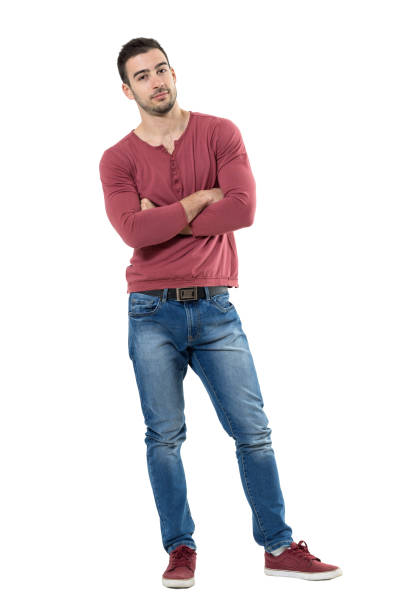 istock Relaxed young casual man with crossed arms leaning and looking at camera. 667055362