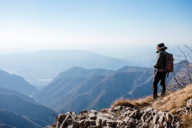 istock Hiker watches a mountain valley 667055418