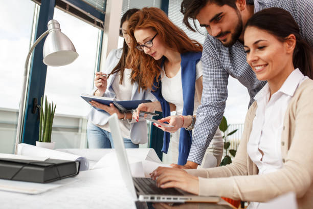 istock Group of business people working on new project . 667055574