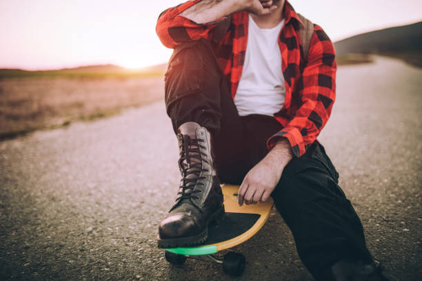 istock Skateboarding in sunset 667056490