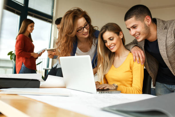 istock Businesswoman and her fellow workers  working on new project 667059010